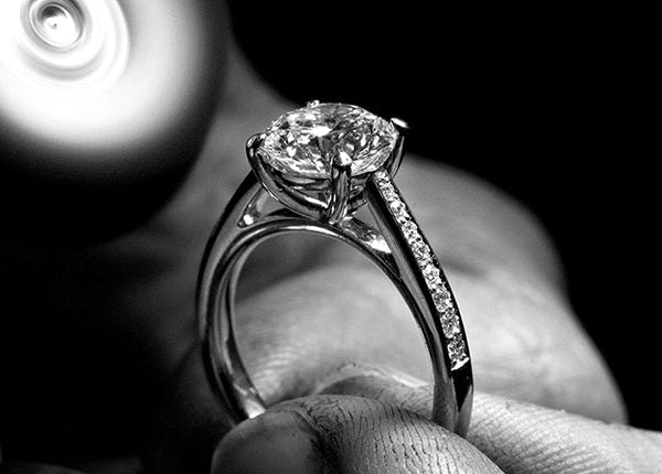 Bespoke engagement ring with a 3ct diamond and pavé diamonds on the sides.